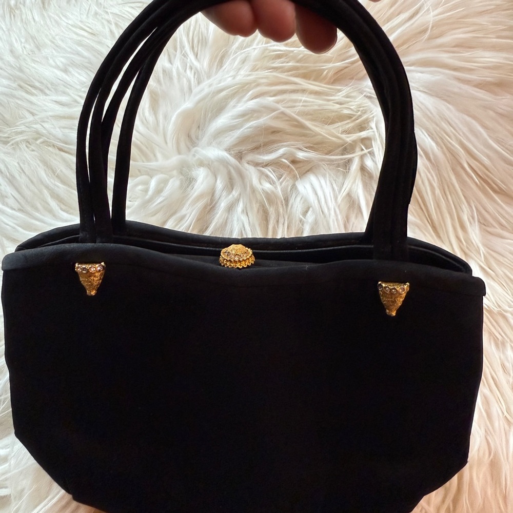 Elegant Black Handbag with Gold Accents